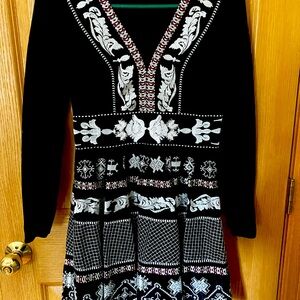 Beautiful suze 2 fit and flare black dress. Embroidered with white beads.